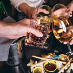 People toasting with drinks