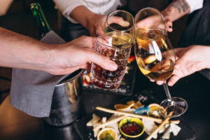 People toasting with drinks