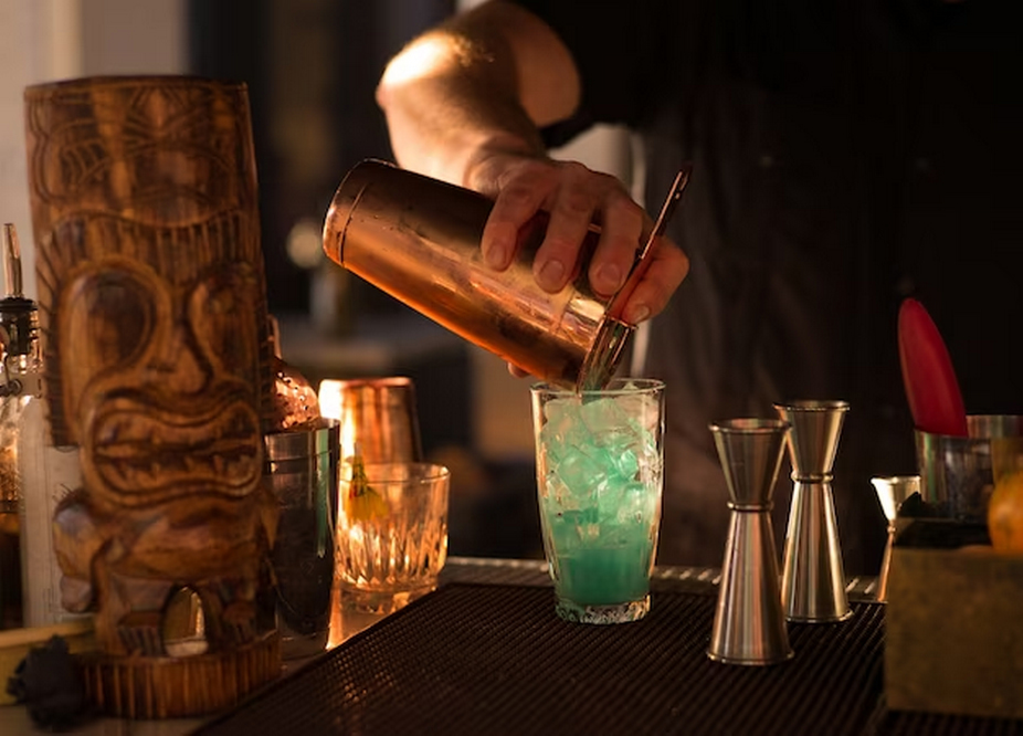 Bartender Pouring Cocktail into Glass