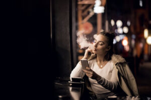 Girl smoking in a restaurant