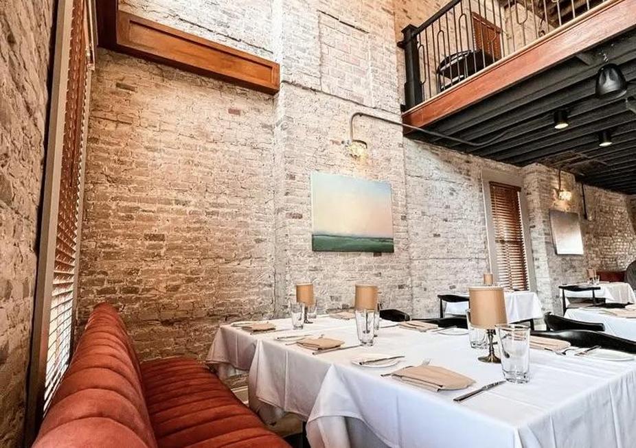 Restaurant, tables near a brick wall