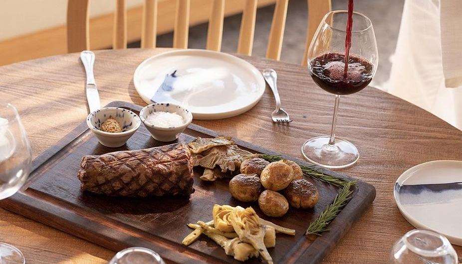 Meat, snacks and wine on the table