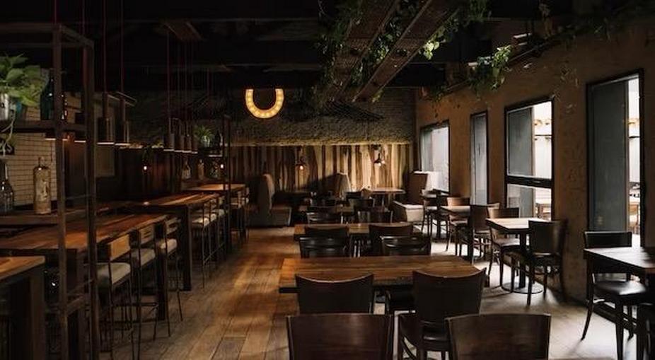 Bar with wooden furniture, view from the inside