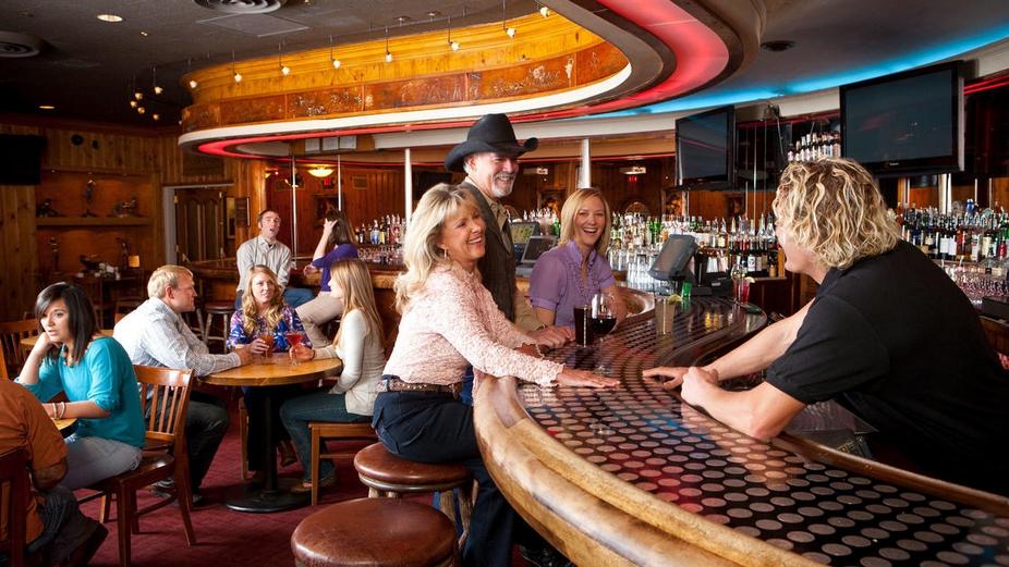 Bartender takes orders from visitors