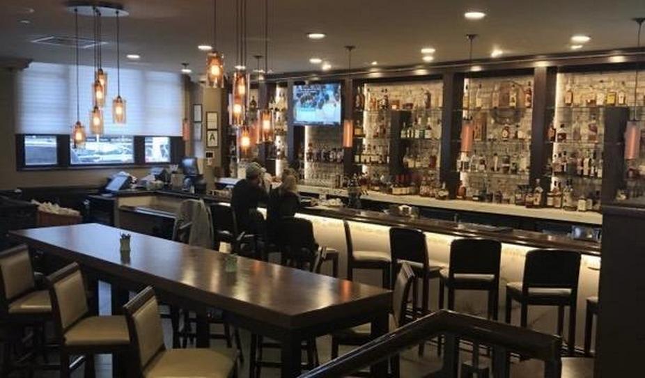 Two people sitting near the bar counter