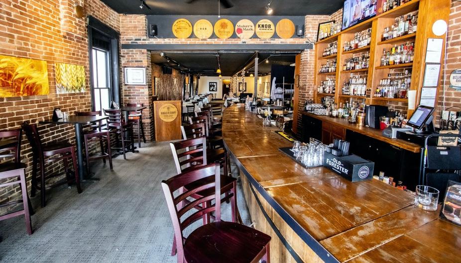 Bar with wooden chairs and bar counter