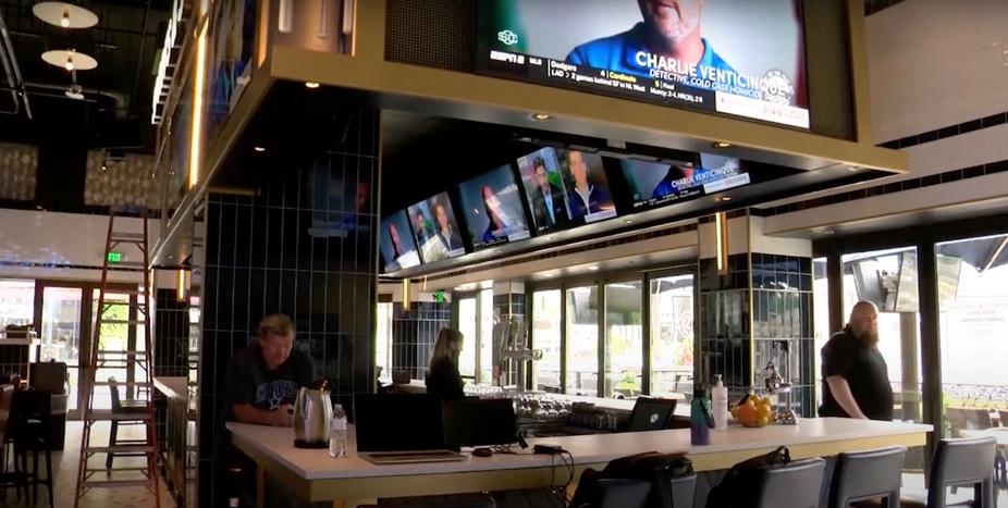 Bar counter, TV screens on top